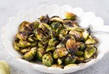 oven roasted Brussel sprouts with balsamic honey vinaigrette in a bowl