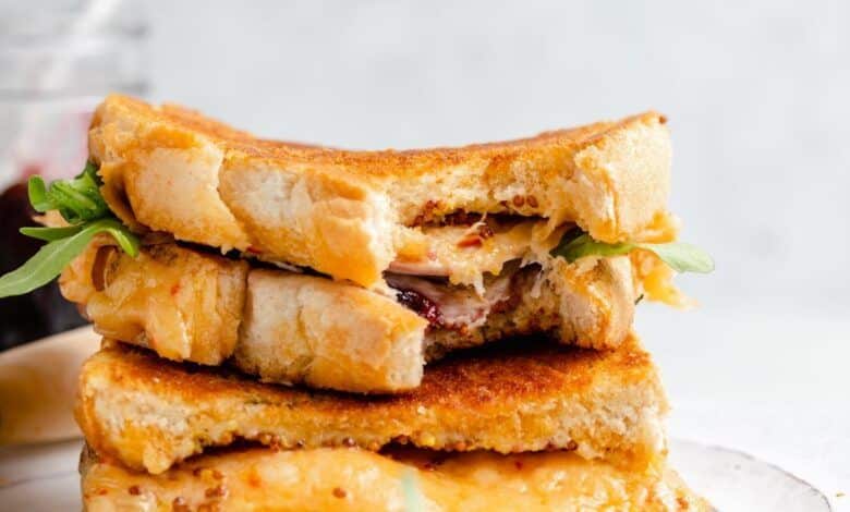 turkey grilled cheese sandwiches with cherry jam in a stack