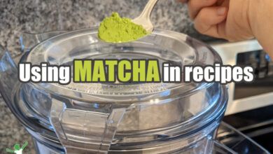 spoonful of matcha green tea powder added to a vitamix smoothie