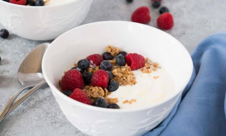 homemade instant pot yogurt in a bowl with granola and berries