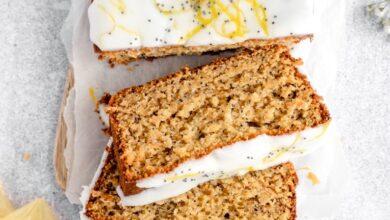 gluten free lemon poppy seed loaf with icing cut into slices