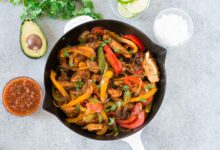 chicken fajitas in a skillet from above