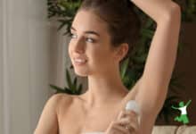 woman applying crystal mineral deodorant to underarm