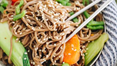 sesame soba noodle recipe in a small dish with metal chopsticks.