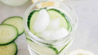 cucumber water in a glass with ice.